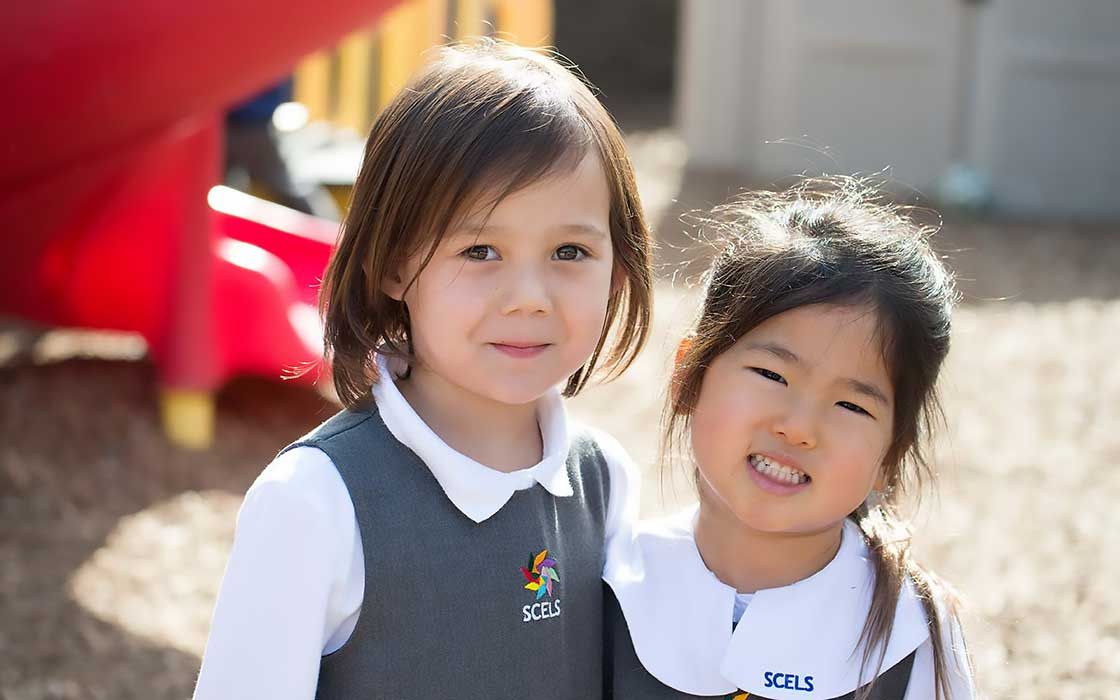 two-girls-in-kindergarten-playground.jpg